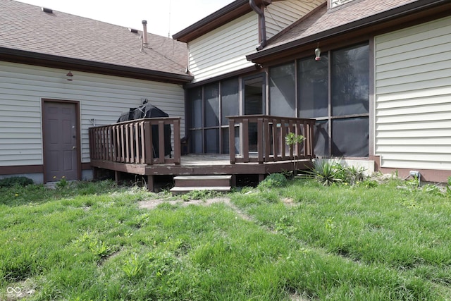 9903 E Raymond St, Indianapolis, IN 46239 - back of house featuring a shingled roof, a sunroom, and a wooden deck