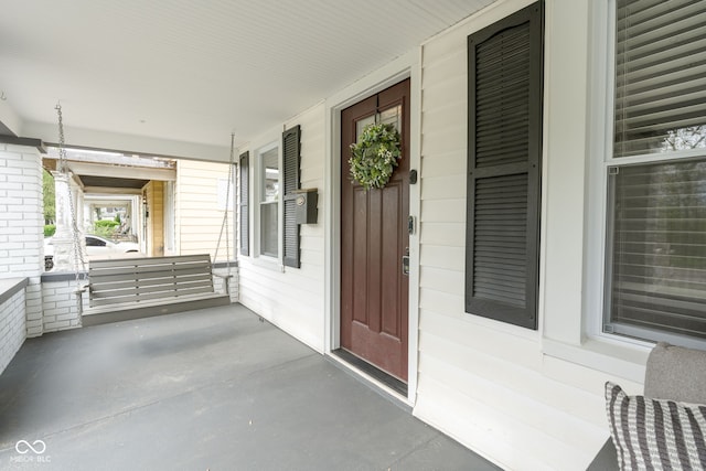doorway to property with a porch