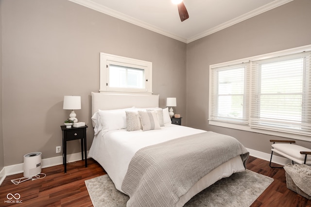 bedroom featuring dark wood-style flooring, baseboards, ornamental molding, and ceiling fan