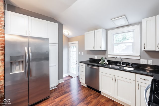 kitchen featuring plenty of natural light, a sink, dark wood-style floors, and stainless steel appliances
