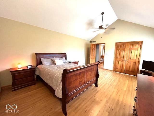 bedroom featuring ceiling fan, lofted ceiling, light wood-type flooring, and visible vents
