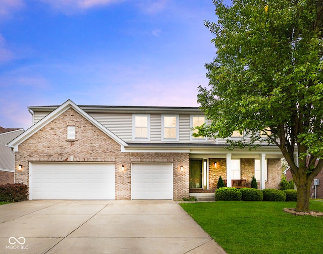 traditional-style house featuring covered porch, concrete driveway, brick siding, and a front yard