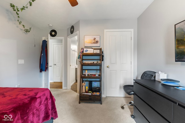 carpeted bedroom featuring a ceiling fan