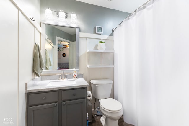 full bathroom featuring vanity and toilet
