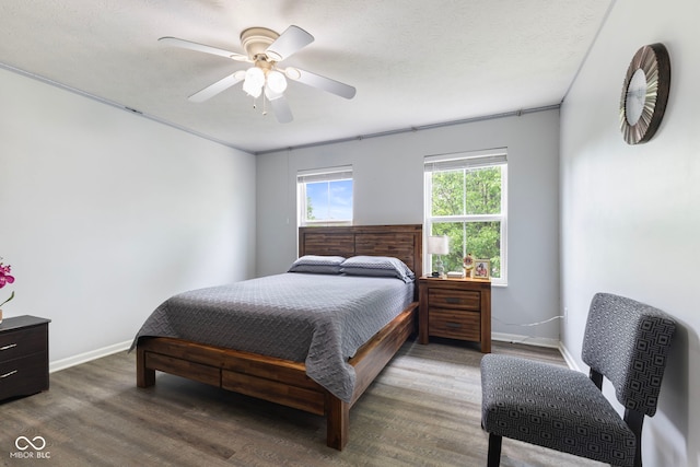 bedroom with baseboards, a ceiling fan, and wood finished floors