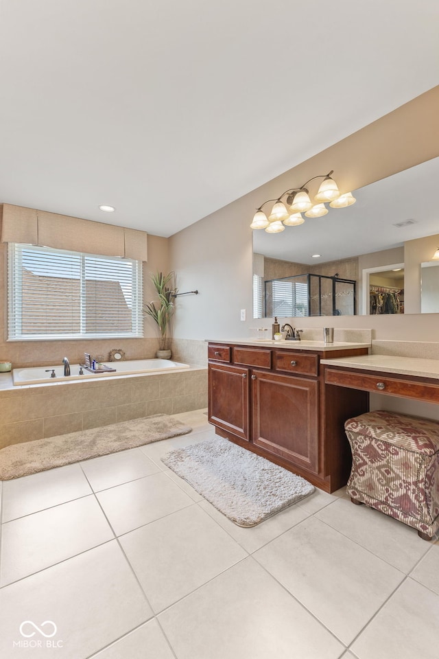 full bath with vanity, a bath, tile patterned floors, and a shower