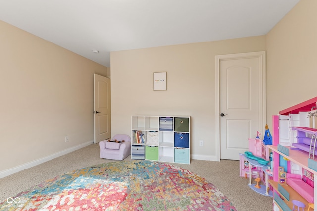 carpeted bedroom featuring baseboards