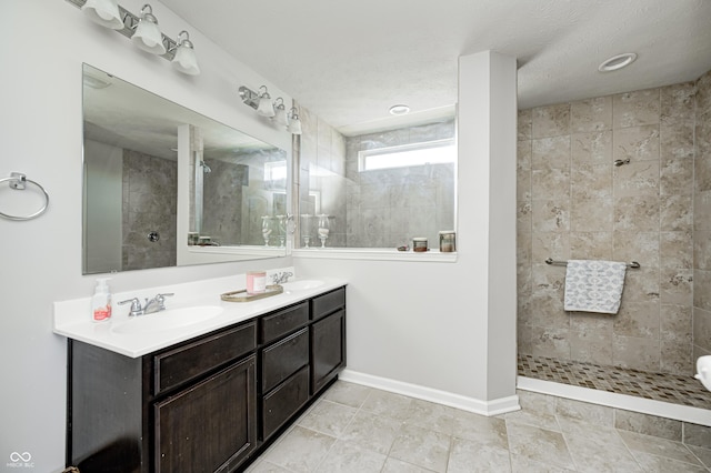14584 Hinton Dr, Fishers, IN 46037 - bathroom with walk in shower, double vanity, tile patterned floors, and baseboards