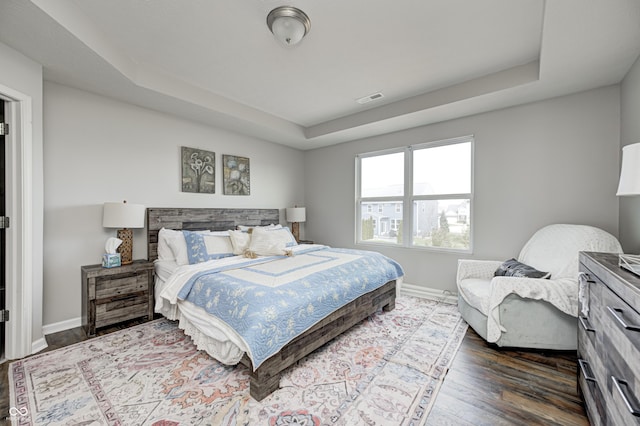 14584 Hinton Dr, Fishers, IN 46037 - bedroom featuring a raised ceiling, wood finished floors, and baseboards