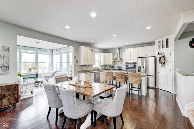 14584 Hinton Dr, Fishers, IN 46037 - dining room with dark wood-type flooring, recessed lighting, and a textured ceiling