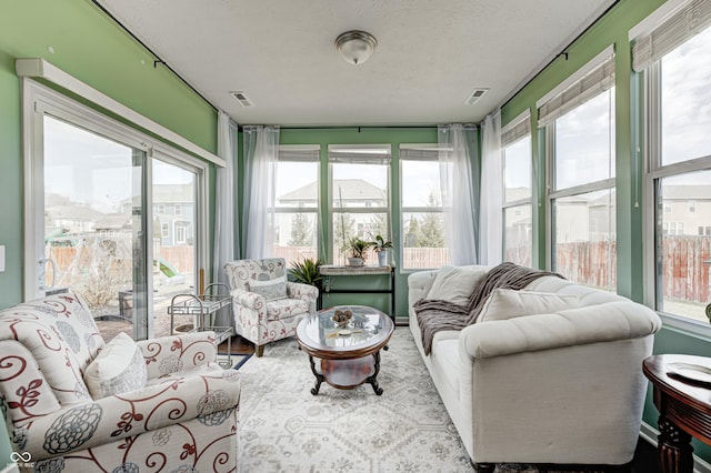 14584 Hinton Dr, Fishers, IN 46037 - sunroom / solarium with a textured ceiling and wood finished floors