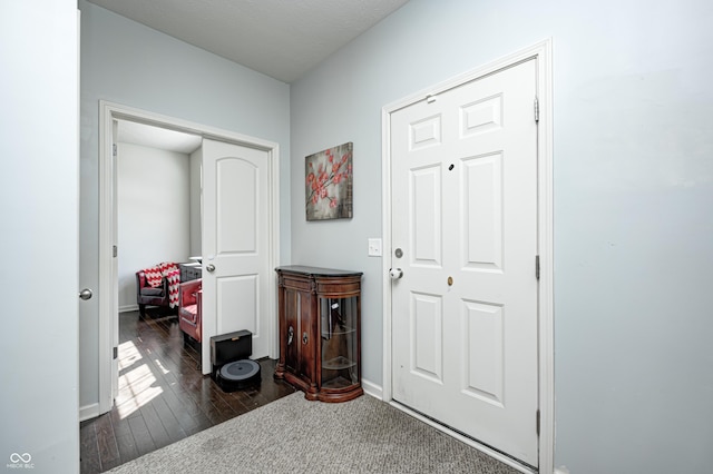14584 Hinton Dr, Fishers, IN 46037 - foyer with dark wood-style floors and baseboards