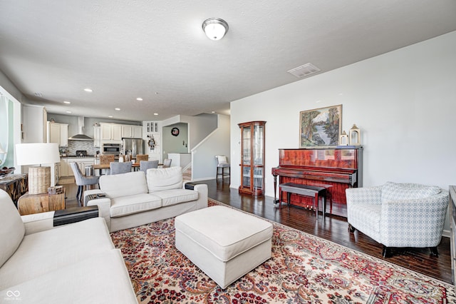 14584 Hinton Dr, Fishers, IN 46037 - living area featuring dark wood-style flooring, recessed lighting, baseboards, and stairway