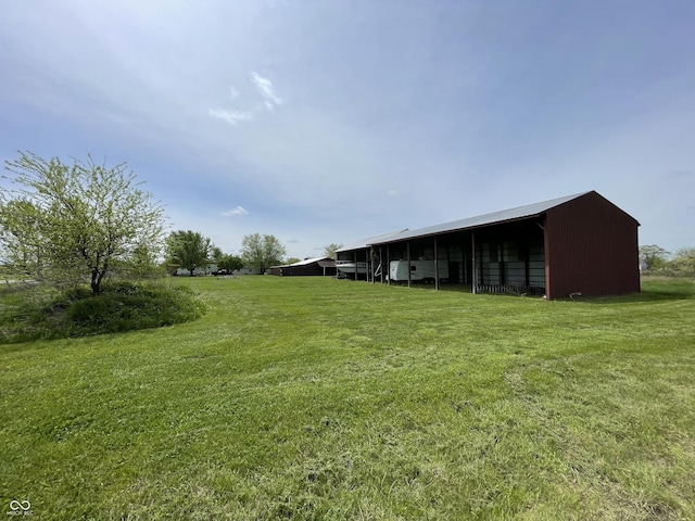 view of yard with an outbuilding and a carport