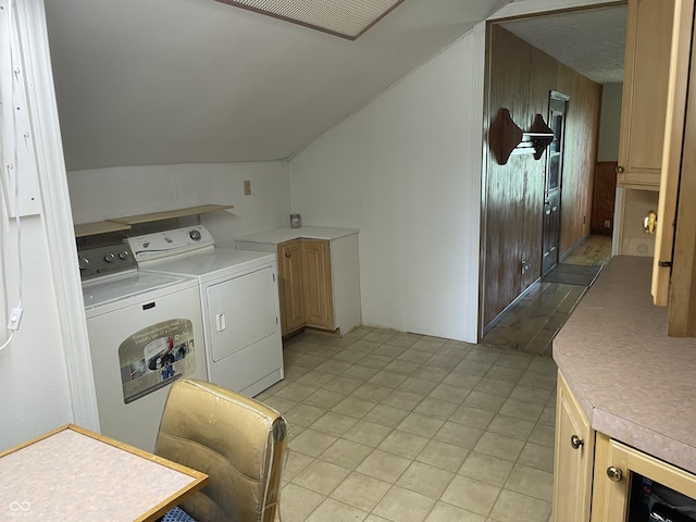 laundry area featuring cabinet space, light tile patterned flooring, wine cooler, visible vents, and washing machine and dryer