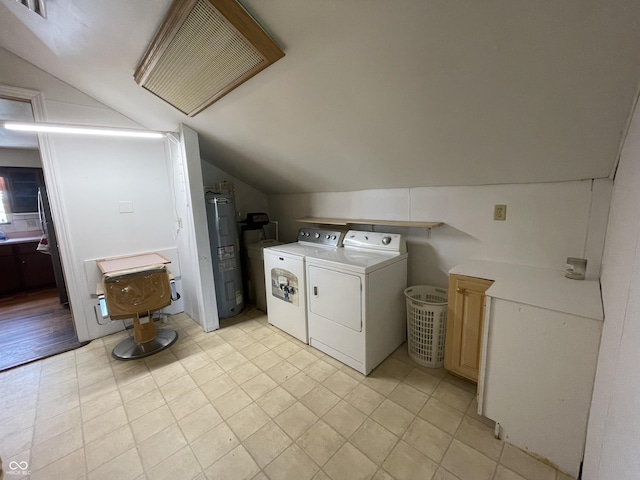 laundry area featuring laundry area, washing machine and dryer, and electric water heater