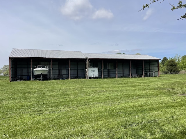 view of pole building with a yard