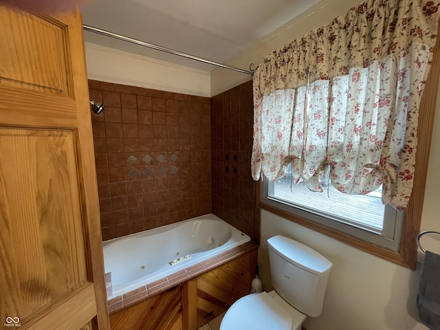 bathroom with a combined bath / shower with jetted tub and toilet