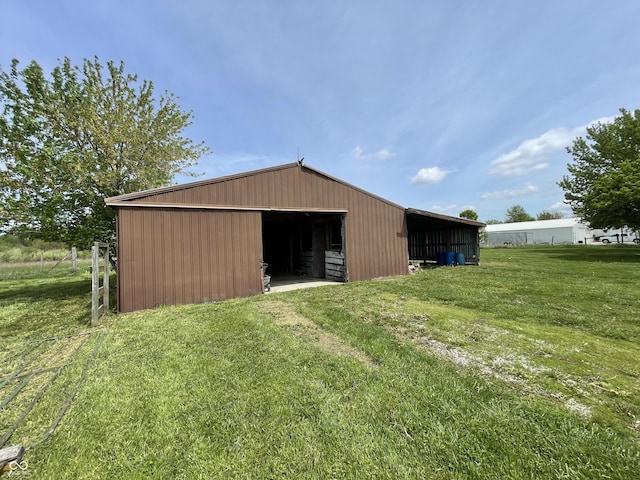 view of pole building with a yard