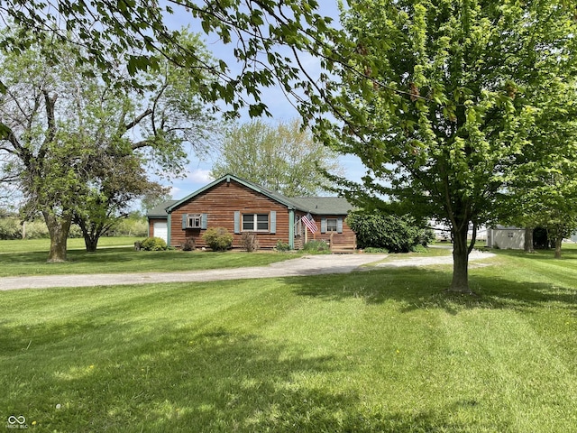 ranch-style house featuring a front lawn
