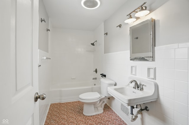 4730 Rookwood Ave, Indianapolis, IN 46208 - bathroom with  shower combination, a wainscoted wall, toilet, and tile walls