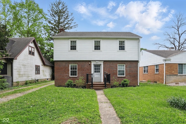 4730 Rookwood Ave, Indianapolis, IN 46208 - colonial-style house featuring central AC unit, a chimney, a front lawn, and brick siding