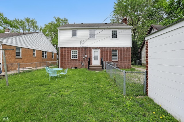 4730 Rookwood Ave, Indianapolis, IN 46208 - rear view of house featuring a yard, brick siding, central AC unit, and fence private yard