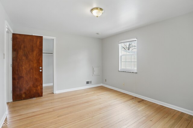 4730 Rookwood Ave, Indianapolis, IN 46208 - unfurnished room with baseboards, visible vents, and light wood-style flooring
