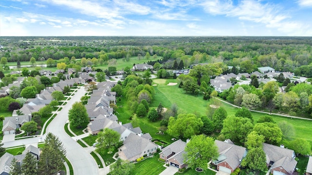 birds eye view of property with a residential view and a forest view