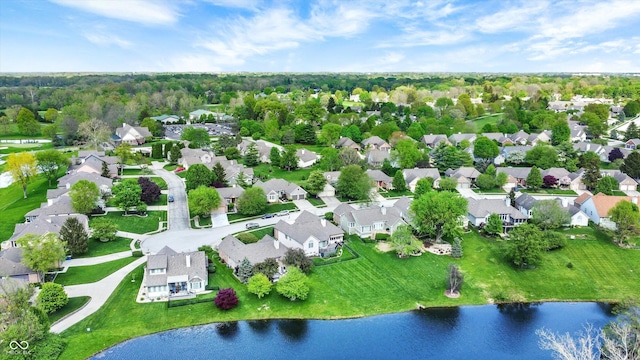 bird's eye view with a water view and a residential view