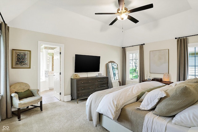 bedroom featuring high vaulted ceiling, multiple windows, light carpet, and a ceiling fan