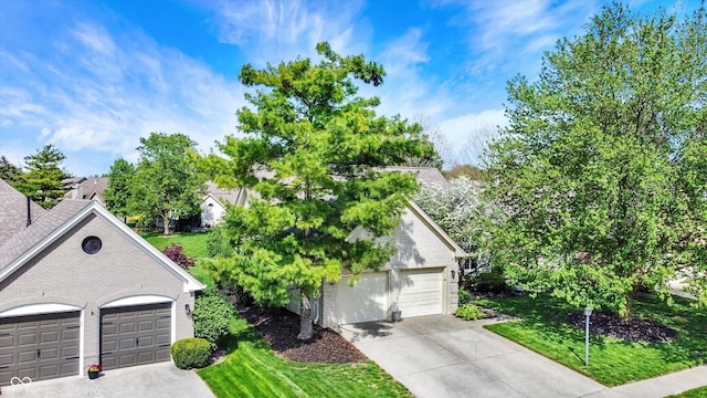 view of front of house with a front yard and brick siding