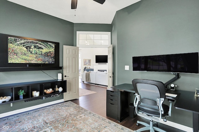 office featuring a ceiling fan and dark wood-style flooring