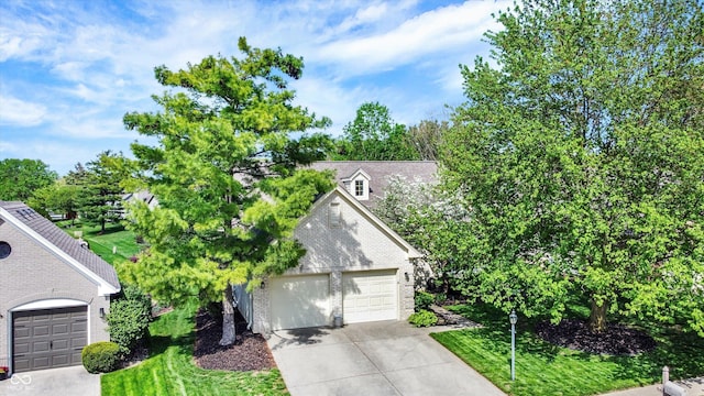 view of front of home featuring brick siding and a garage