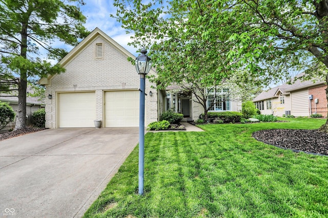 view of front of home featuring concrete driveway, brick siding, a front yard, and a garage