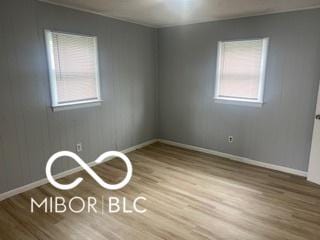 1710 S Birch St, Muncie, IN 47302 - spare room featuring baseboards and wood finished floors