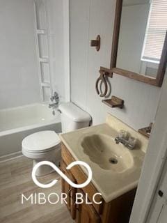 1710 S Birch St, Muncie, IN 47302 - full bathroom with toilet, wood finished floors, vanity, and shower / washtub combination
