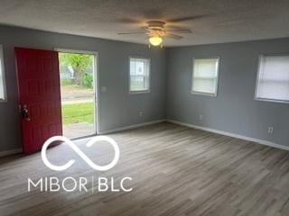 1710 S Birch St, Muncie, IN 47302 - empty room featuring baseboards, ceiling fan, and wood finished floors