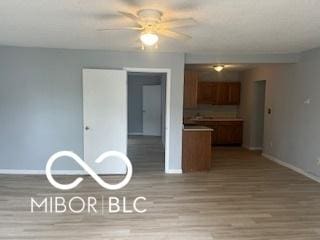 1710 S Birch St, Muncie, IN 47302 - interior space featuring baseboards, a ceiling fan, and wood finished floors