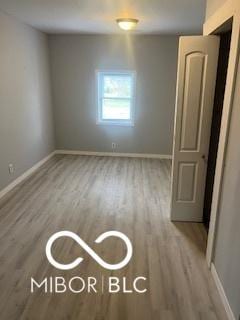1710 S Birch St, Muncie, IN 47302 - spare room with baseboards and wood finished floors