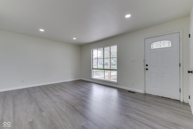 entrance foyer featuring recessed lighting, baseboards, and wood finished floors
