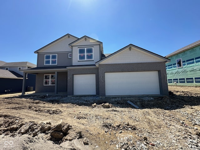 201 Ames Dr, Whiteland, IN 46184 - view of front facade with brick siding and covered porch