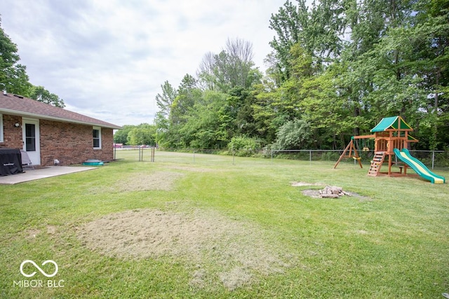 5340 N State Highway 7, North Vernon, IN 47265 - view of yard featuring a playground and a patio