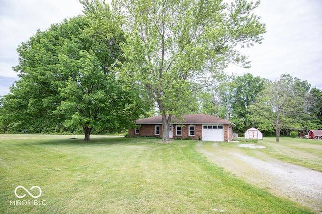 5340 N State Highway 7, North Vernon, IN 47265 - single story home with dirt driveway, an attached garage, a front yard, view of scattered trees, and brick siding
