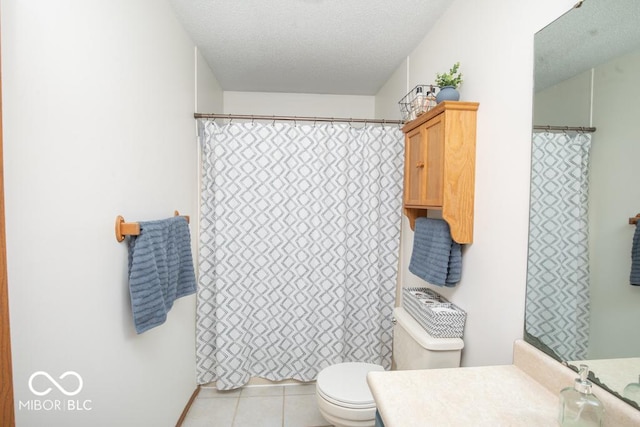 5340 N State Highway 7, North Vernon, IN 47265 - full bath featuring toilet, vanity, tile patterned flooring, a textured ceiling, and a shower with shower curtain