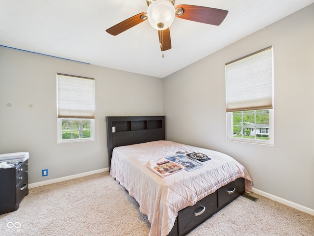 bedroom with baseboards, ceiling fan, and carpet flooring