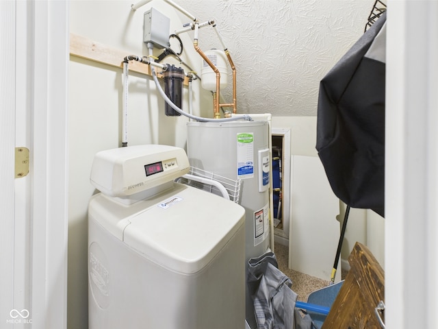 laundry area featuring laundry area and electric water heater