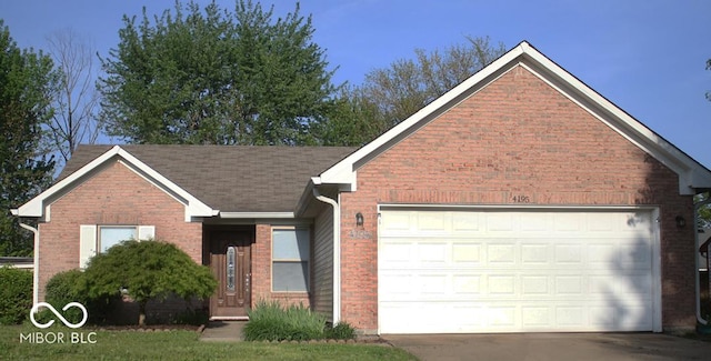 single story home featuring an attached garage, brick siding, and driveway
