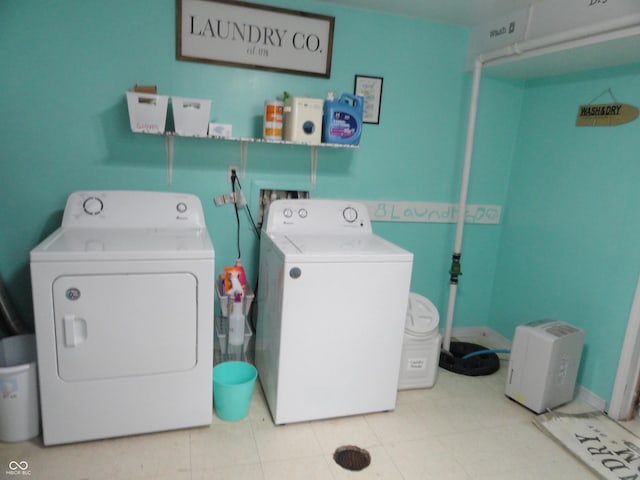 3426 Ireland Dr, Indianapolis, IN 46235 - laundry area featuring laundry area, washer and clothes dryer, and baseboards