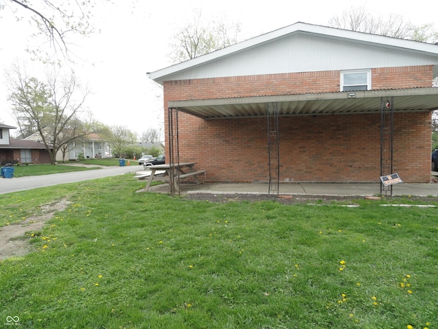 3426 Ireland Dr, Indianapolis, IN 46235 - view of home's exterior featuring a yard and brick siding